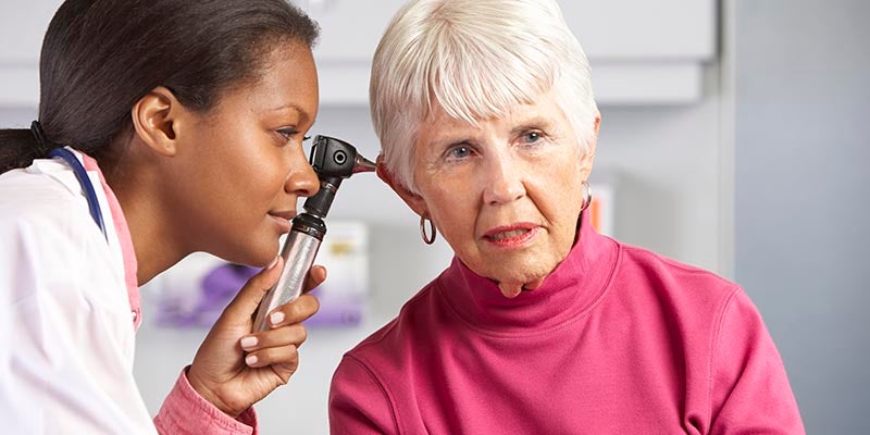 doctor checking patient ears