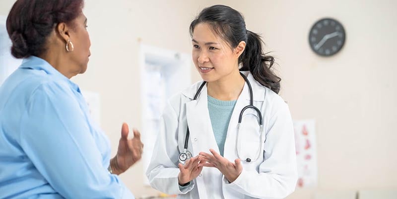 Woman talking with a medical professional