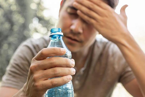 man with water bottle