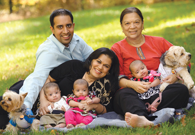 Rupal and Ravi Shah with their triplets, Rupal's mom and their two pet dogs