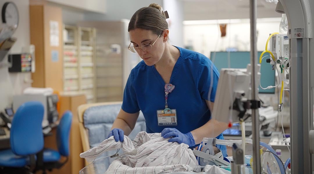 NICU nurse with baby